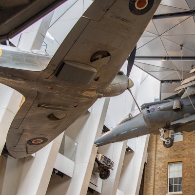 Photo of a Spitfire and Harrier in the museum