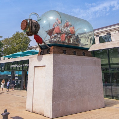 Photo of a sculpture of a boat in a bottle outside the museum.