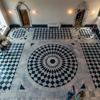 Photo of the black and white tiled floor in the centre of the house.