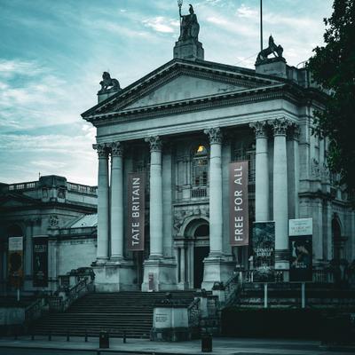 Moody photo of The Tate Britain, with a banner showing "Free for all"