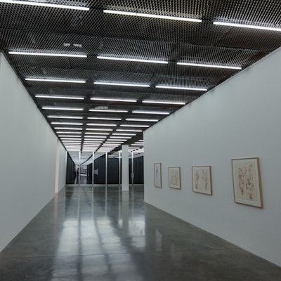 Photo of a stark corridor lit by flourescent tubes