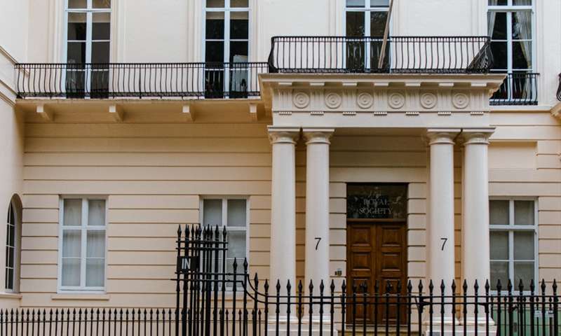 Photo of the exterior of the Royal Society, a classical building.