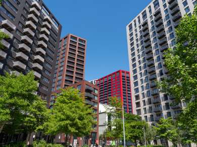 High rise flats in the City Island development, one is clad in glazed bright red brick.