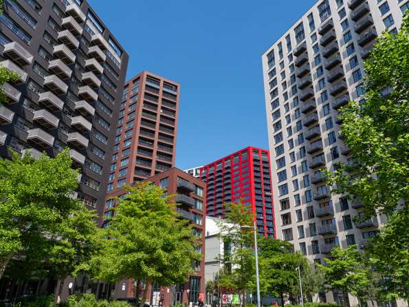 High rise flats in the City Island development, one is clad in glazed bright red brick.