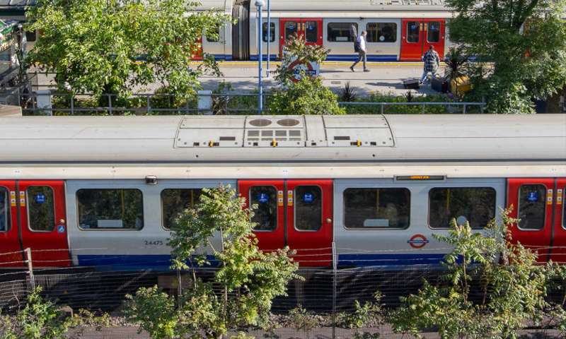 Photo of two Underground trains standing at South Kensington station.