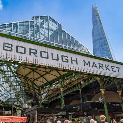 Photo of the wood & iron canopy over Borough Market, with BOROUGH MARKET written in huge letters on it.