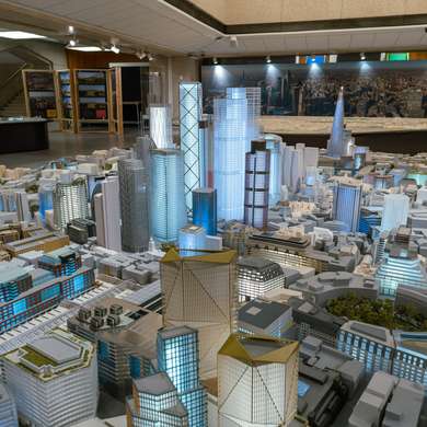 Photo of a scale model of London, with illuminated skyscrapers.