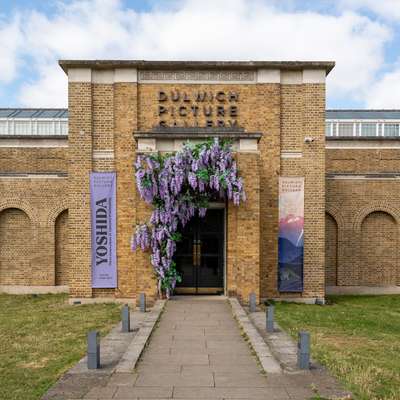 Photo of the exterior of the Dulwich Picture Gallery, a classical brick building.