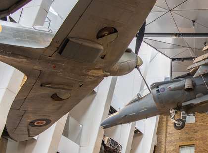 Photo of a Spitfire and Harrier in the museum