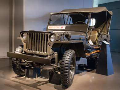 Picture of a World War 2 Jeep with "British Red Cross" written on it.