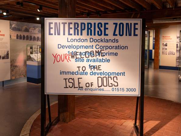 A replica Docklands Development Corporation sign that has been ostensibly defaced by residents.