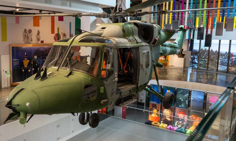 Photo of an army helicopter suspended above an atrium.