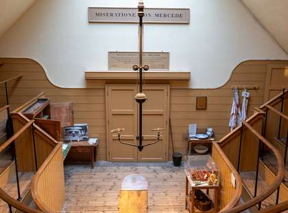 Photo of the operating theatre, a semicircular room with raised viewing area.