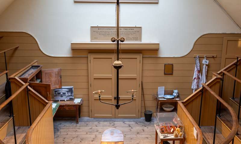 Photo of the operating theatre, a semicircular room with raised viewing area.