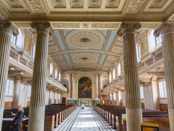 A view from the back to the front of the chapel, with classical columns in the foreground.