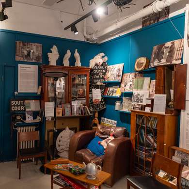 A corner of the People's Museum, with an arm chair, furniture and all kinds of other exhibits.