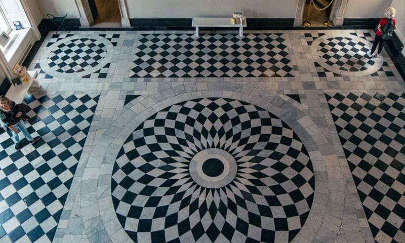 Photo of the black and white tiled floor in the centre of the house.