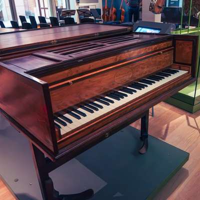 Photo of a keyed musical instrument, a piano or harpsichord maybe