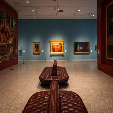 The Collection Gallery at the Royal Academy of Arts,  with the painting "Flaming June" in the background
