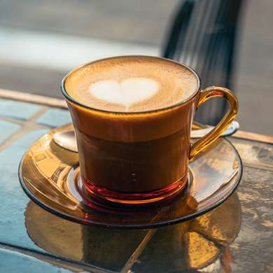 Photo of a flat white in a Duralex cup.