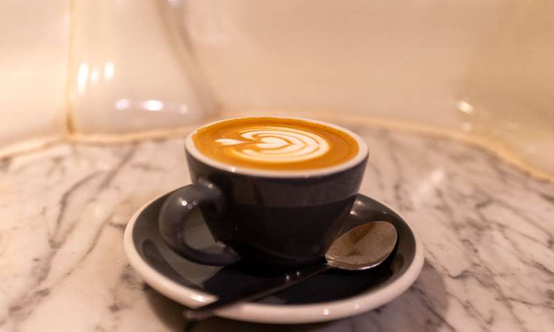 Photo of a flat white on a bar table created from a urinal. Lovely.